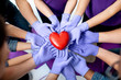 © rh2010 - Group of people holding with hands in medical gloves red heart model. Close-up view. Healthy heart concept.