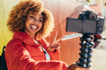 Female tourist recording content for her travel blog