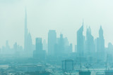 Fototapeta Miasta - Dubai, UAE - October, 2018. Beautiful skyline of Dubai surrounded by sand dust at day light
