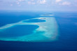 Aerial of the beautiful Maldives, looking down at some stunning islands and atolls