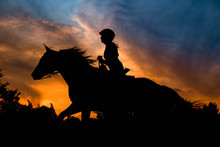 Girl Riding In Silhouette