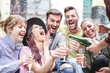 © Alessandro Biascioli - Group of happy friends doing party throwing confetti and drinking champagne outdoor - Young people having fun celebrating birthday together - Friendship and youth holidays lifestyle concept