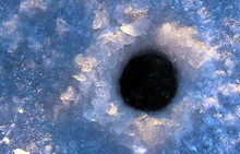 On The Ice Drilled A Hole For Fishing