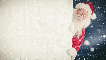 Wall Mural - Santa clause holding a sign combined with falling snow