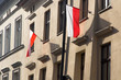 Polskie flagi wywieszone na budynku. Dzień Niepodległości w Polsce. 