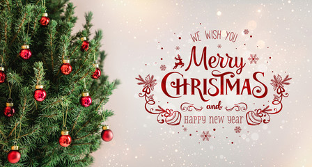 Wall Mural - Christmas tree with red decorations and text Merry Christmas on holiday background with snow, blurred, sparking, glowing. Happy New Year and Xmas theme