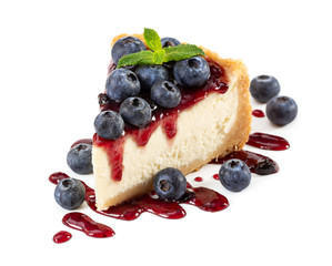 Wall Mural - Piece of cheesecake with blueberries and mint isolated on white