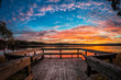 Picture of colorful sunset on the lake with wooden pier