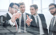 © ASDF - businessman discusses with the business team a new marketing plan