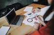 © Yakobchuk Olena - Concept of successful team work. Side on of female and male business partners working on project schemes while sitting in office