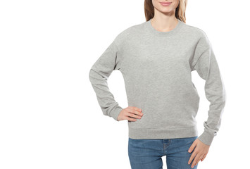Wall Mural - young girl in gray sweatshirt, gray hoodies front view. white background.