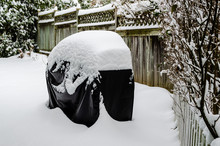 Three Quarter View Of A Barbecue Covered In Deep Fresh Snow