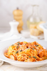 Poster - Spaghetti bolognese pasta with tomato sauce, vegetables and chicken meat on white wooden rustic background. Traditional italian food