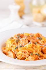 Poster - Spaghetti bolognese pasta with tomato sauce, vegetables and chicken meat on white wooden rustic background. Traditional italian food