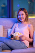 woman watch tv with popcorn