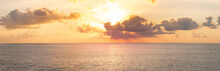 Panoramic Beautiful View On Sunset Over The Ocean. Сolorful Cloudy Sky And Setting Sun