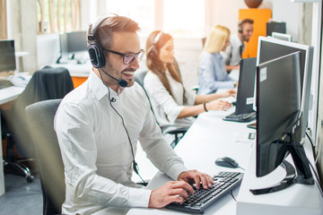 young male technical support dispatcher in call center