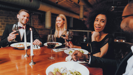 Wall Mural - Friends Chilling Out Enjoying Meal in Restaurant