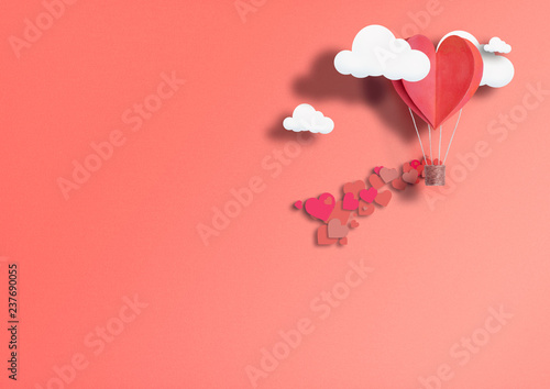illustration for Valentine\'s Day. Living heart shaped balloons Living Coral fly among the clouds and praise love. concept of love peace and happiness.