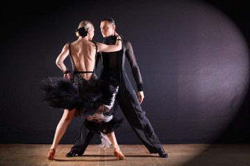 Wall Mural - dancers in ballroom isolated on black background