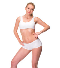 Wall Mural - Young beautiful blonde woman in white fitness clothing