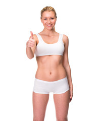 Wall Mural - Young beautiful blonde woman in white fitness clothing