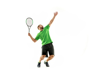 The one caucasian man playing tennis isolated on white background. Studio shot of fit young player at studio in motion or movement during sport game..