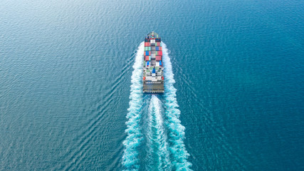 Sticker - Container ship in export and import business and logistics. Shipping cargo to harbor by crane. Water transport International. Aerial view and top view.