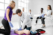 © rh2010 - Group of young medics practising to make artificial breathing with medical dummies during the first aid training in the white room