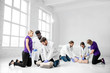 © rh2010 - Group of young medics practising to make artificial breathing with medical dummies during the first aid training in the white room