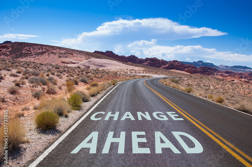 The text Change ahead written on a empty road in the desert of Nevada before t Poster Mural XXL