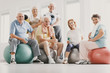 © Photographee.eu - Low angle on smiling active elderly people on balls after physical classes in sport club