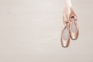 Ballet shoes on wooden floor