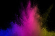 © wooddy7 - abstract powder splatted background. Colorful powder explosion on black background. Colored cloud. Colorful dust explode. Paint Holi.