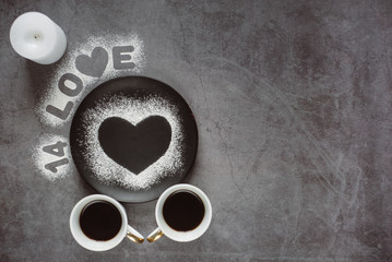 Valentines day.Two  cup of coffee,  candle and heart on dark background. To the day of all the lovers