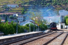Train Coming To The Station At Pinhao In Douro Valley, Portugal