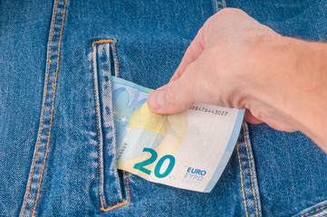 Theft euro banknote from jeans pocket