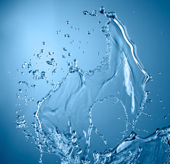 blue color water splash isolated on empty background, studio photo