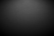 Dark horizontal background with brush texture. Vector background with lighting.