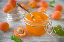 Jar With Homemade Apricot Jam On A Light Wooden Background