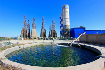 Wall Mural - Drilling rig derrick and pools in MaCheng iron mine, China