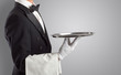 © ra2 studio - Waiter serving with white gloves and steel tray in an empty space