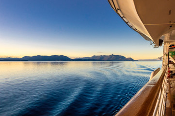 Wall Mural - Beautiful morning light and water ripples from ship's wake, Alaska, USA.