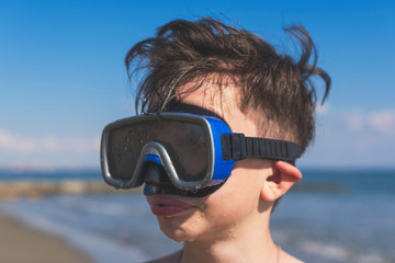 Wall Mural - Closeup of boy face in the snorkeling mask and tube. Travel and summer concept