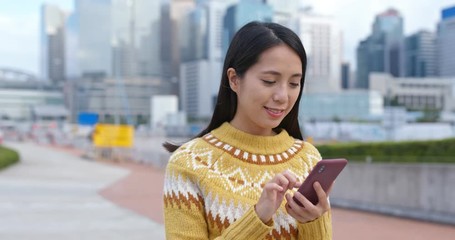 Sticker - Woman search on cellphone in city