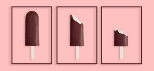 Three ice cream chocolates  on a pink background in the framework, as an art object. One whole, two half eaten.