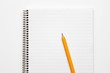 © Игорь Шишкин - Yellow pencil on a lined notepad on a spiral on a white background