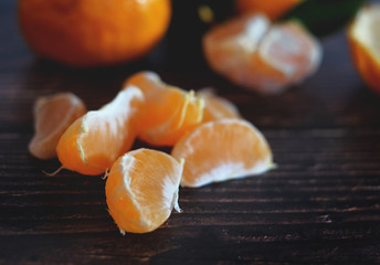 fresh ripe tangarines on the wooden background.