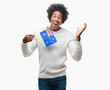 © Krakenimages.com - Afro american man flag of Australia over isolated background very happy and excited, winner expression celebrating victory screaming with big smile and raised hands