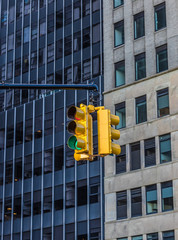 Fototapete - Traffic light in the background of skyscrapers. New York